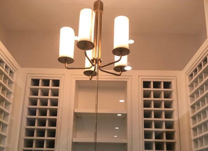 Wine room chandelier installation