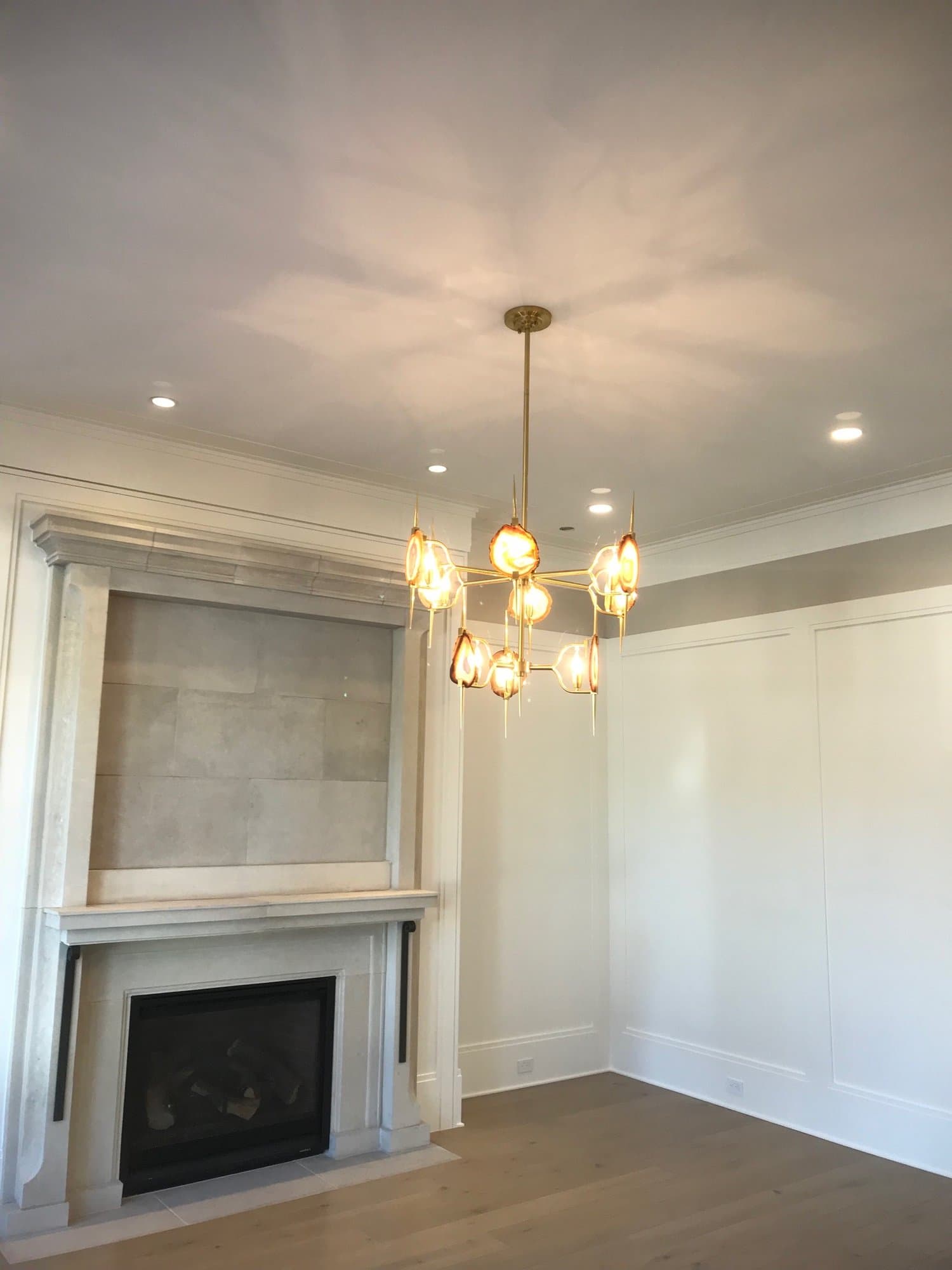 Statement chandelier with fireplace